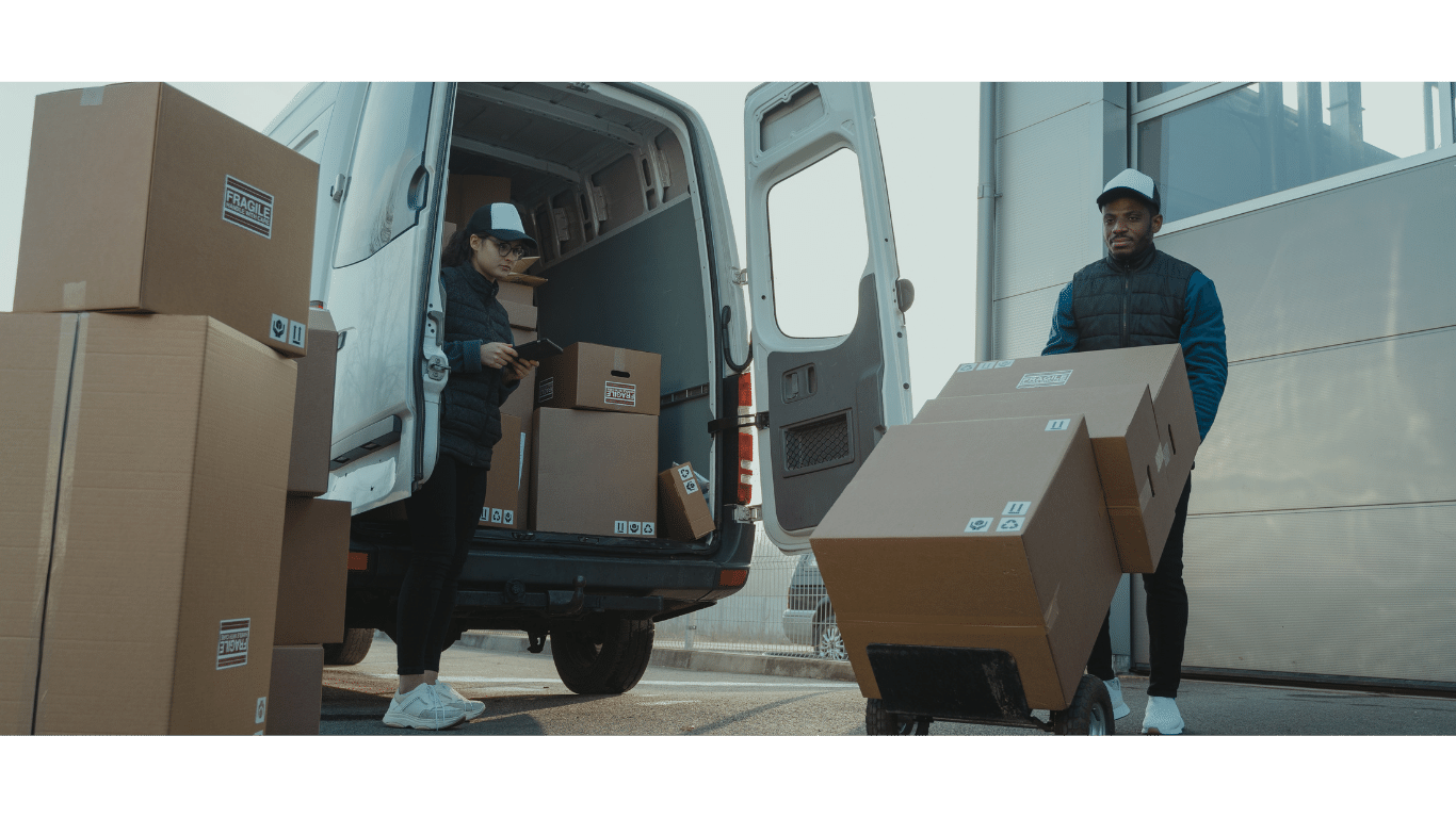 a man is moving boxes of boxes into a van