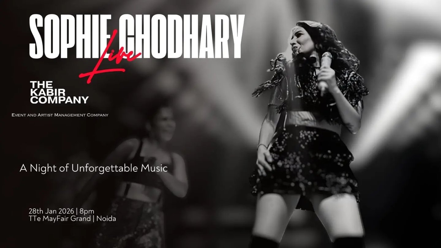 a woman in a short dress and boots is holding a microphone