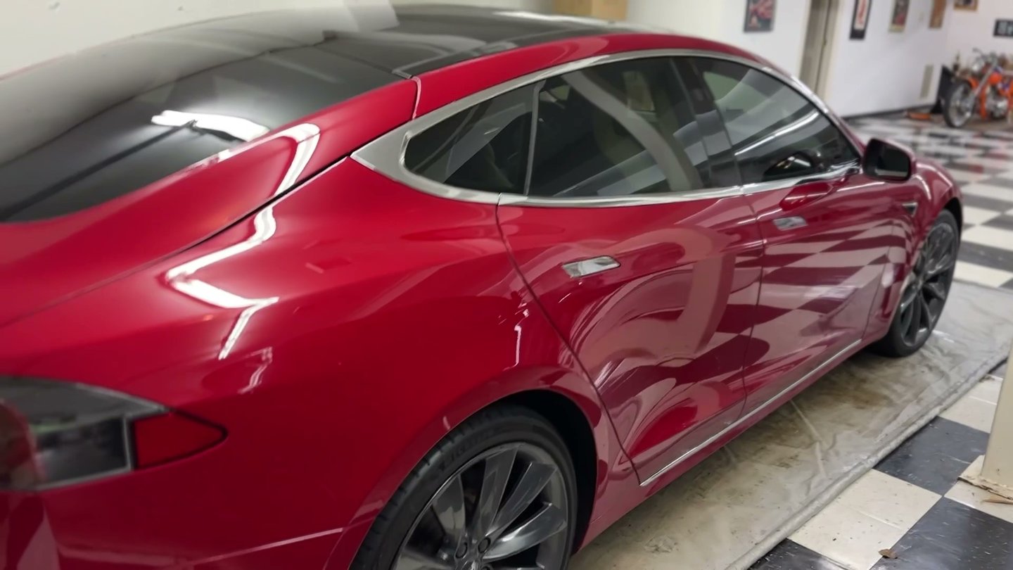 ceramic coating of a high end red tesla that is glossy