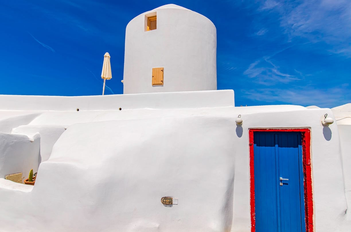 a lighthouse tower with umbrellas and umbrellas