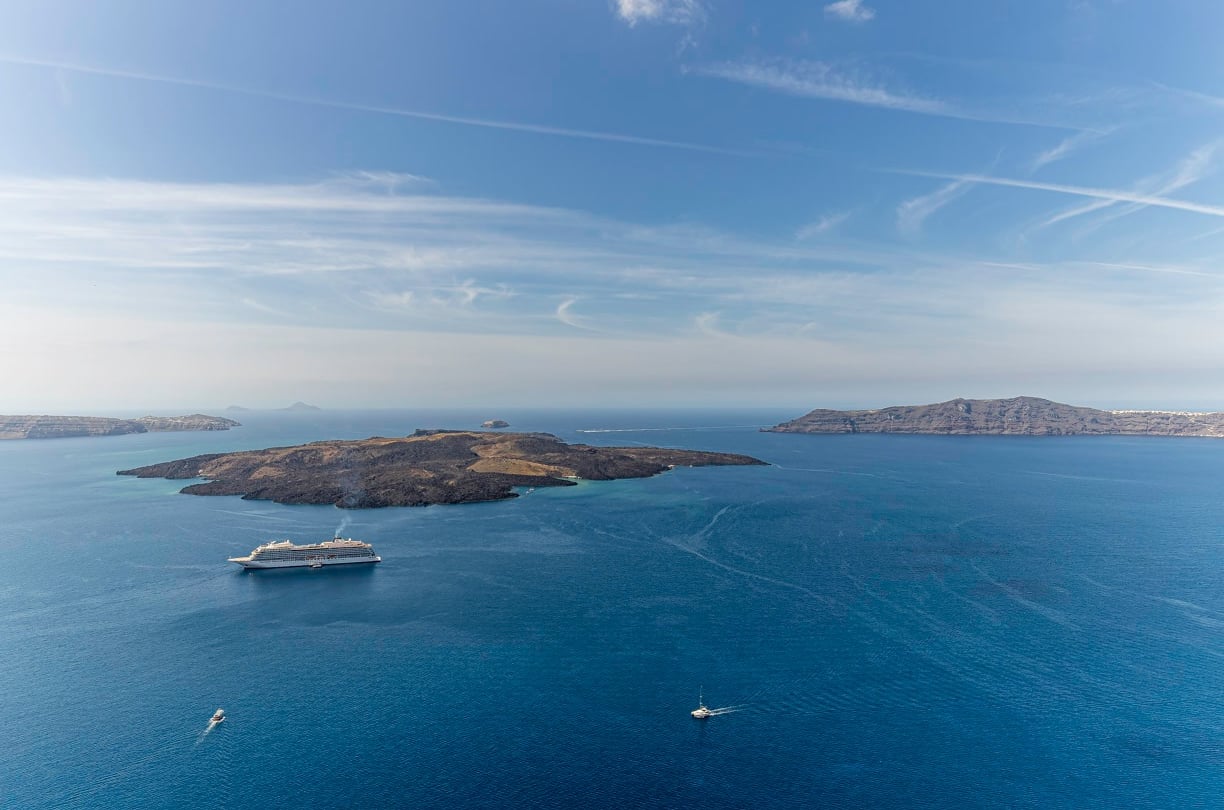 a cruise ship in the water with a cruise ship in the background