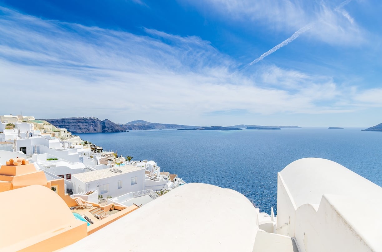 Santorin a view of a sea view of a city