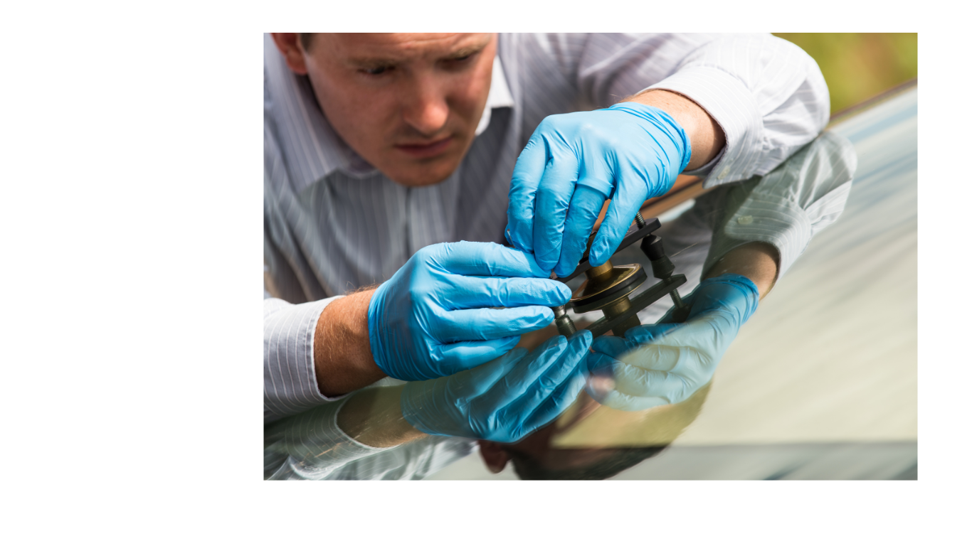 a man in gloves and gloves is holding a pair of scissors