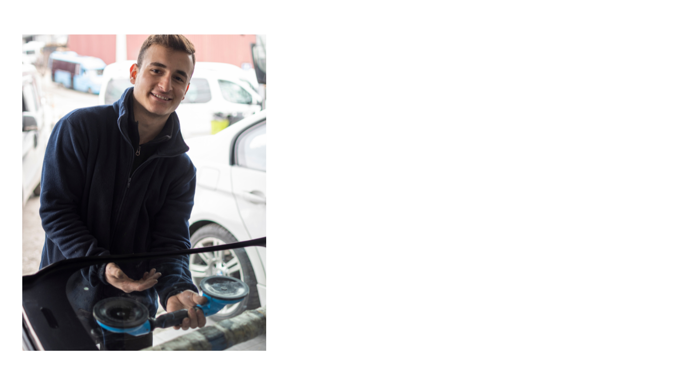 a man is holding a car with a car washer