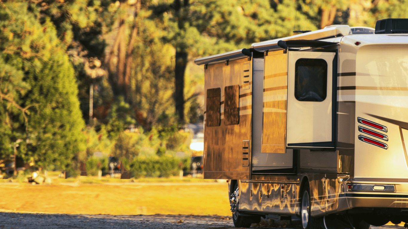 a camper trailer parked in a field