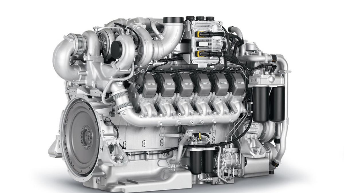 A high-performance MTU marine diesel engine with a multi-cylinder block and turbocharger on a white background.