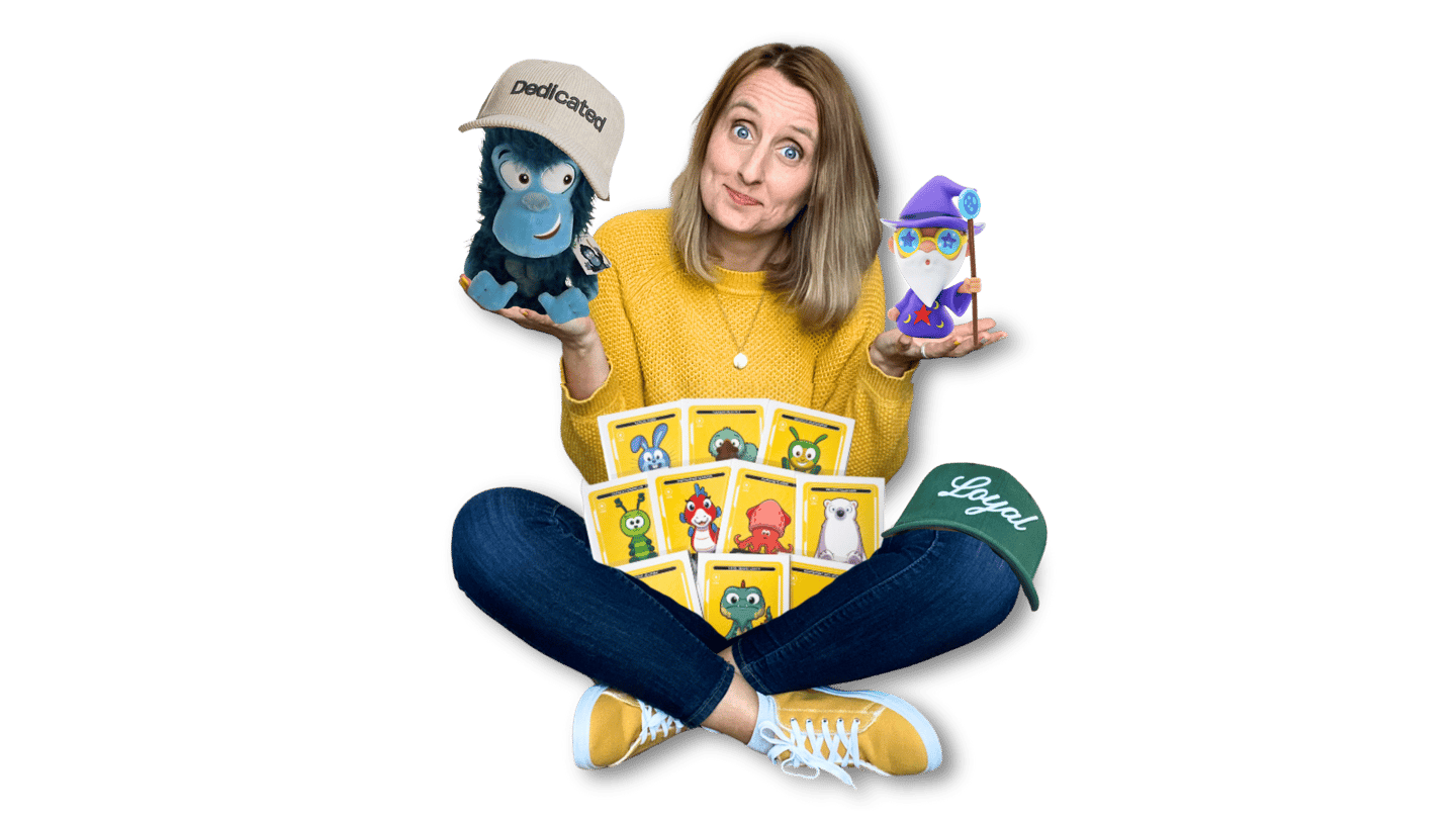 Anne Bagg holding physical Veefriends collectibles like friendscaps, plushies, trading cards, figure