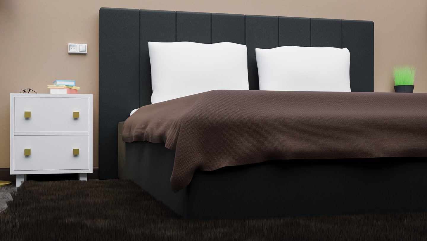 a bed with a brown blanket and a end-table 