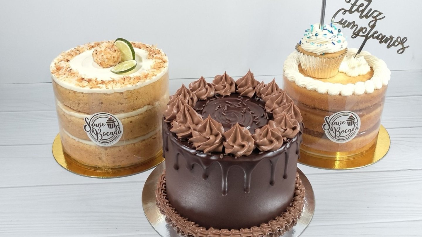 three cakes with chocolate frosting and frosting on them