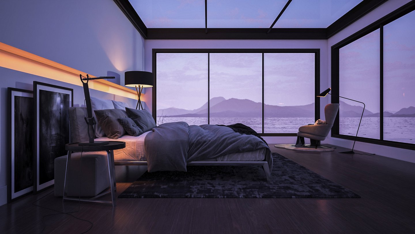 Modern bedroom with large bed, floor-to-ceiling windows, and view of lake and mountains.