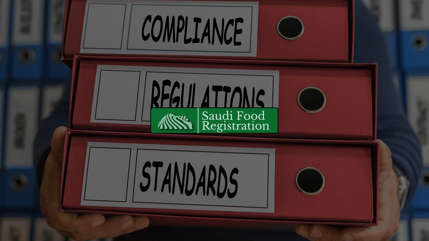 Red folders labeled compliance, regulations, and standards representing SFDA compliance documentation.