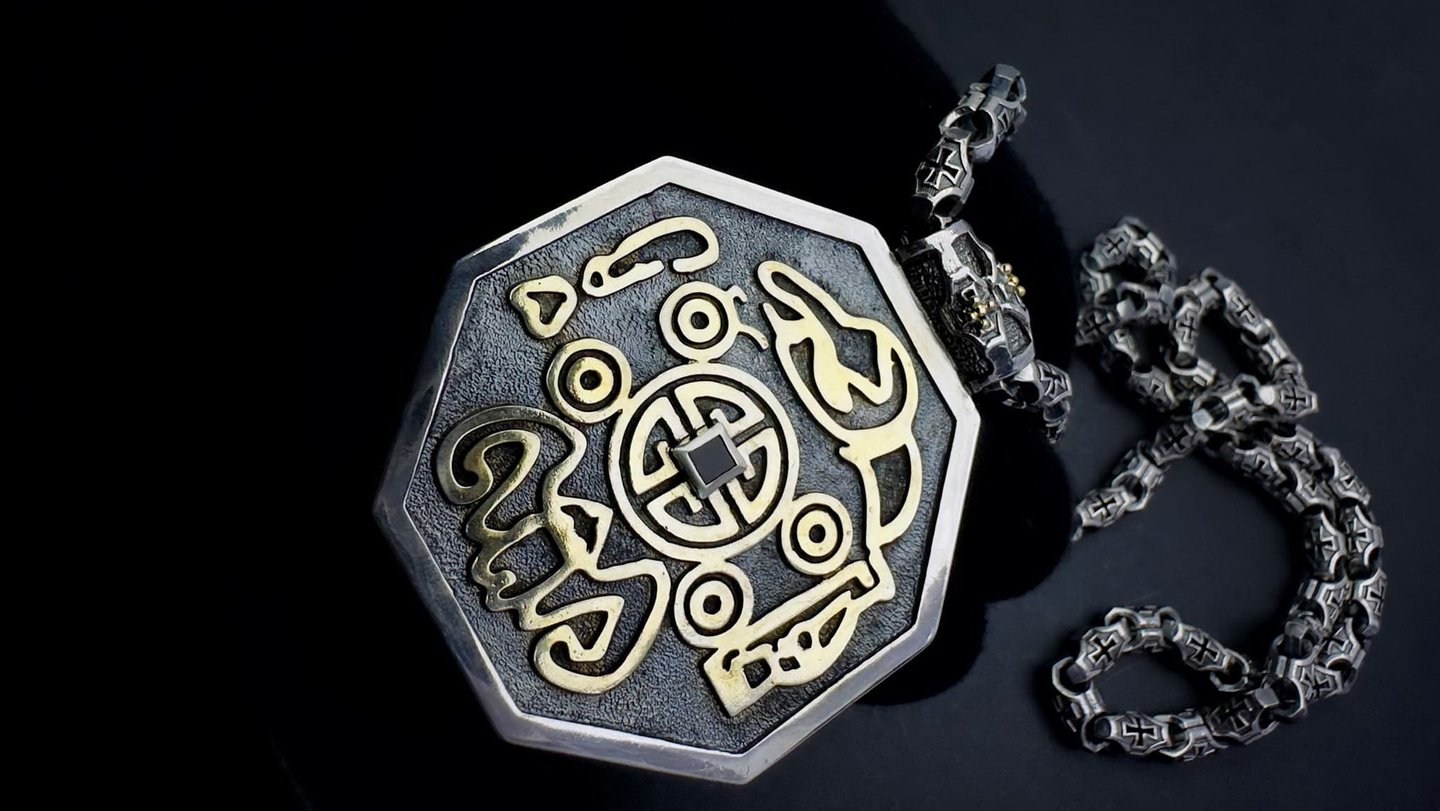 a silver and gold necklace with a MONEY sign