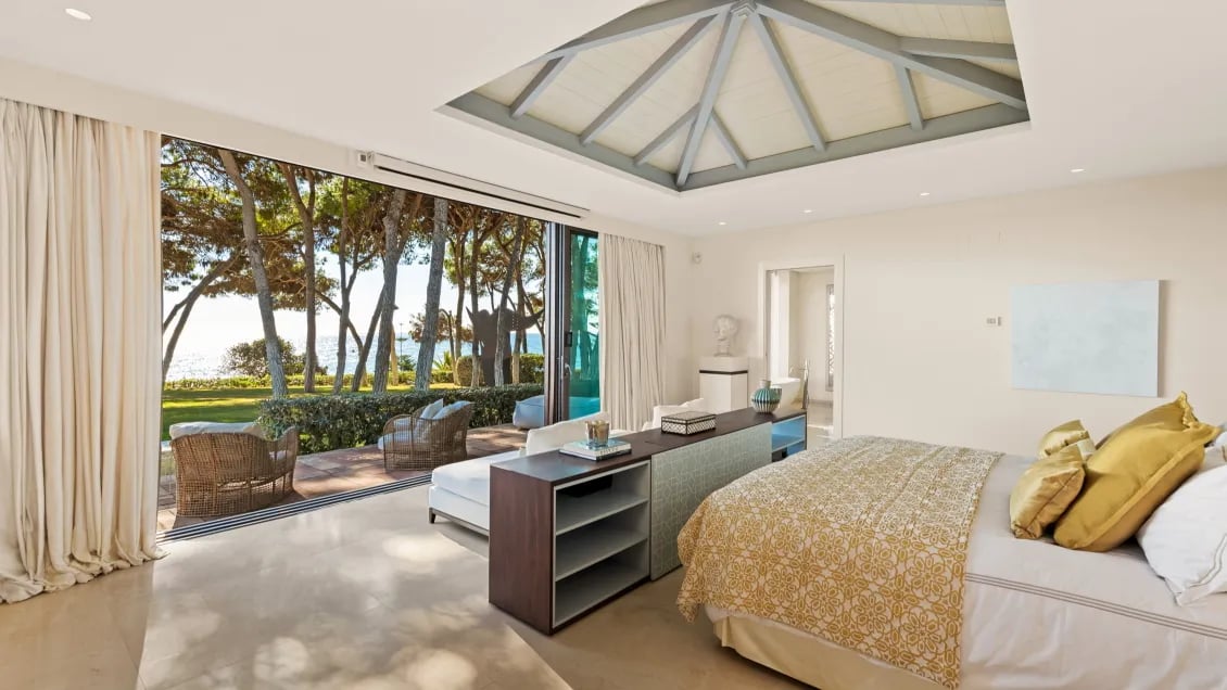 Bedroom at Villa El Rincon with canopy ceiling and sea views 