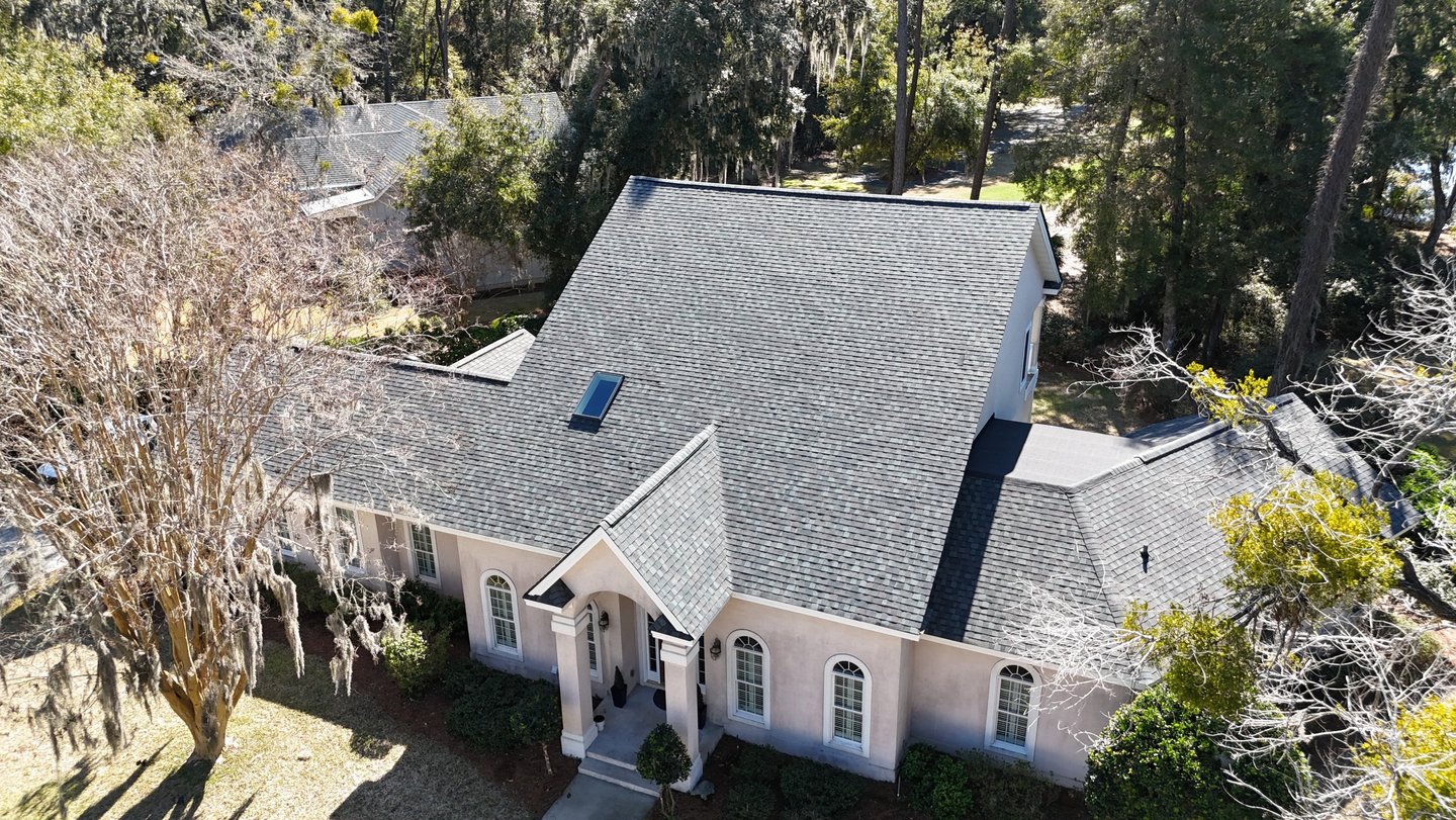 a house with a roof that has a roof that is covered in black