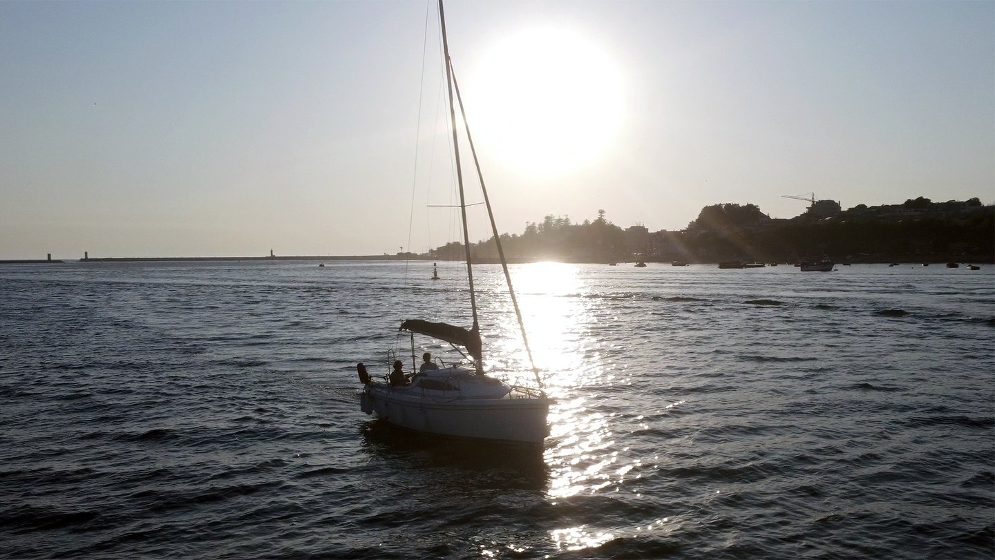 The sailboat Monark sailing on the Douro River at sunset