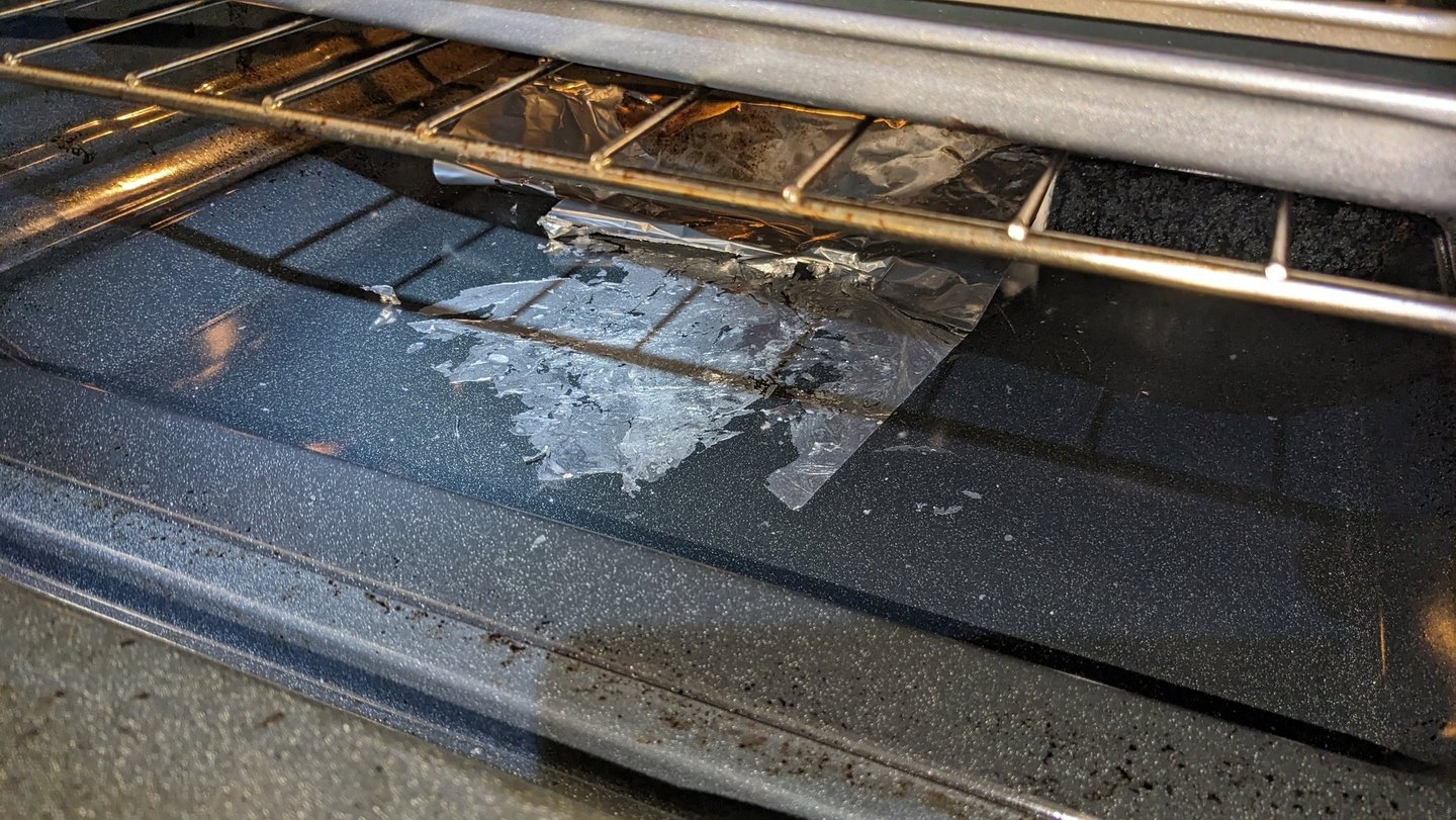 Burnt aluminum folio inside a stove