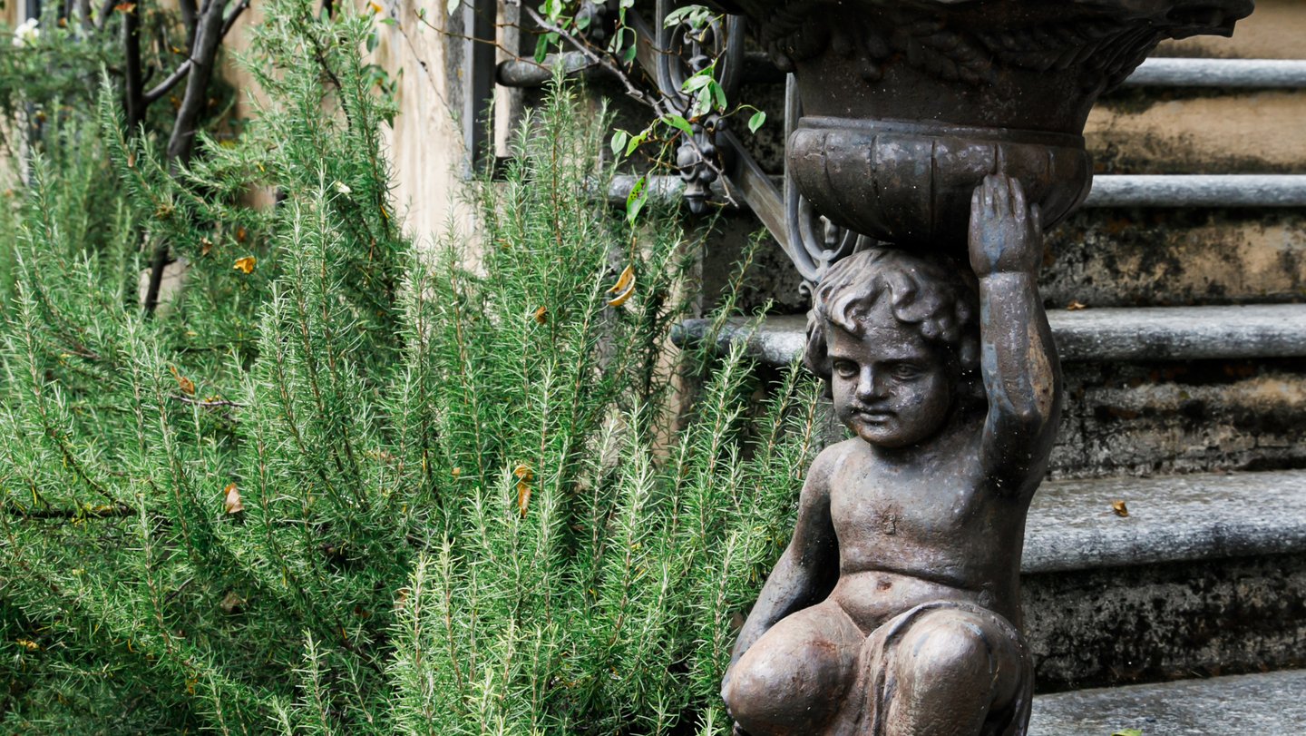 Tuscan-inspired herb garden with stone accents and Mediterranean-style plantings.