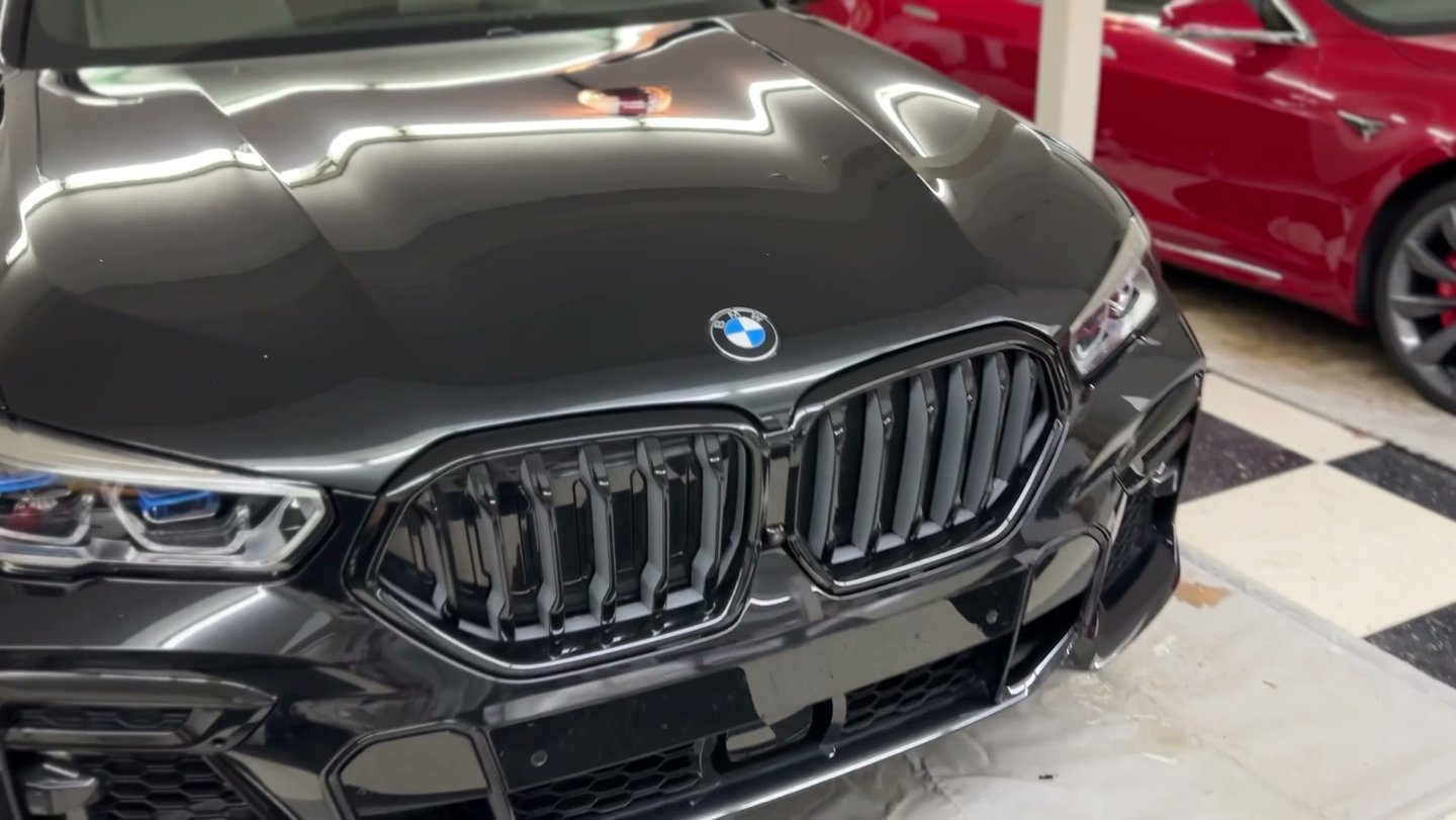 paint polished with ceramic coating of a black bmw suv