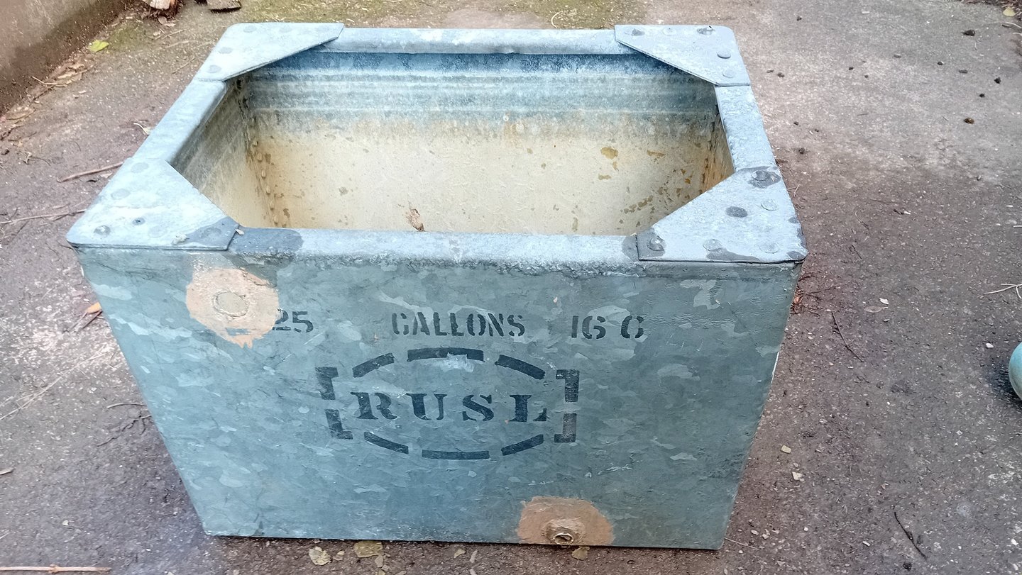 Old rectangular galvanised steel cold water tank