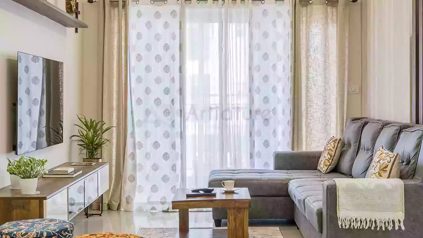 a living room with a couch and a television