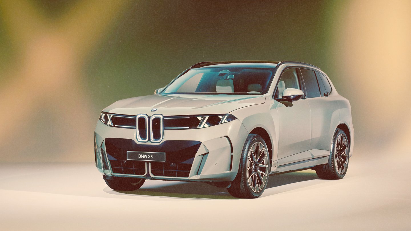 A silver BMW X5 luxury SUV concept featuring a modern front grille and sleek headlights.