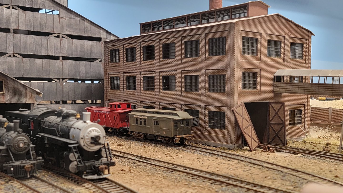 Superior Mine diorama with locomotive and mine buildings.
