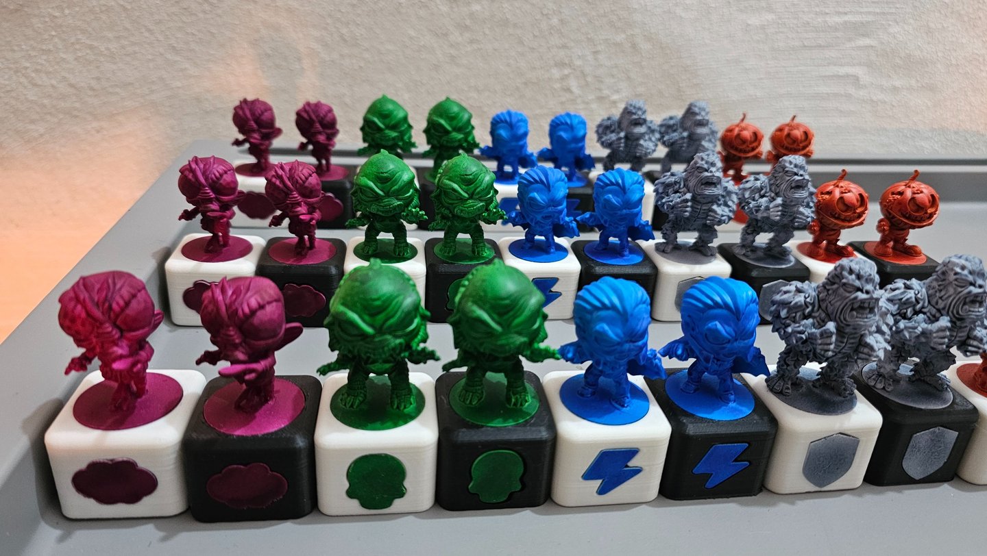 a bunch of different colored toys on a table