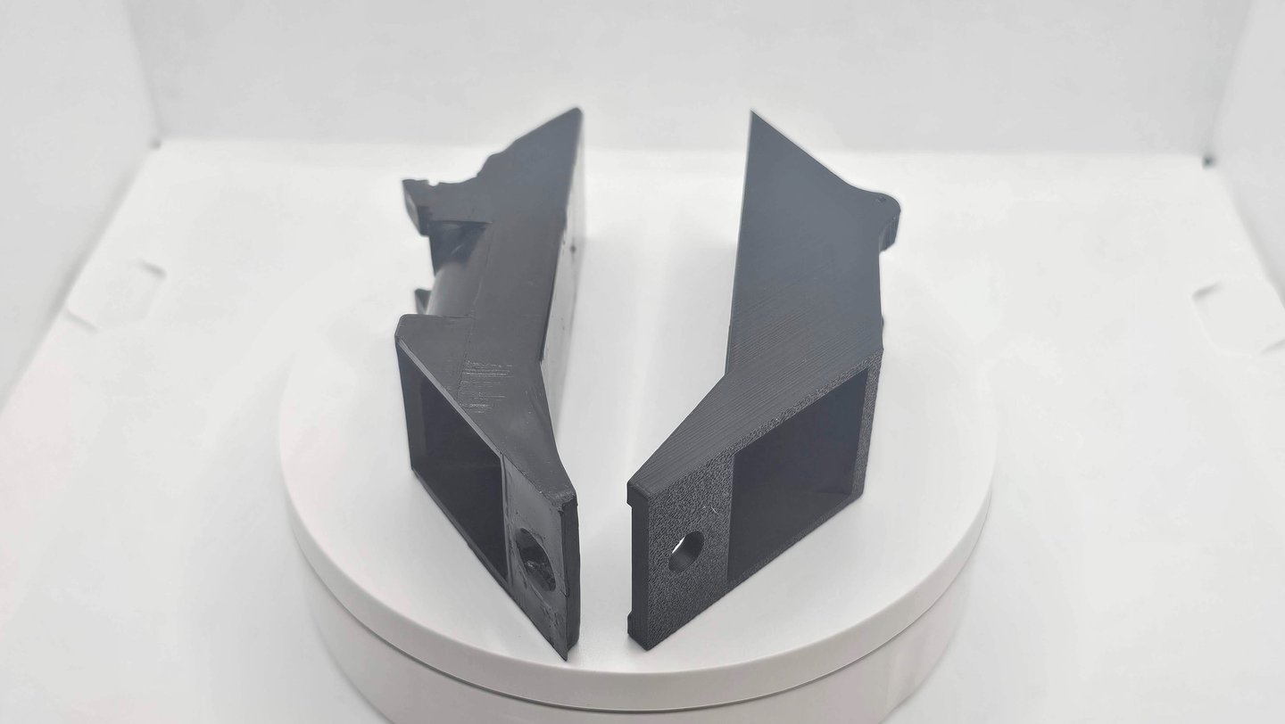 a pair of black and white plastic brackets