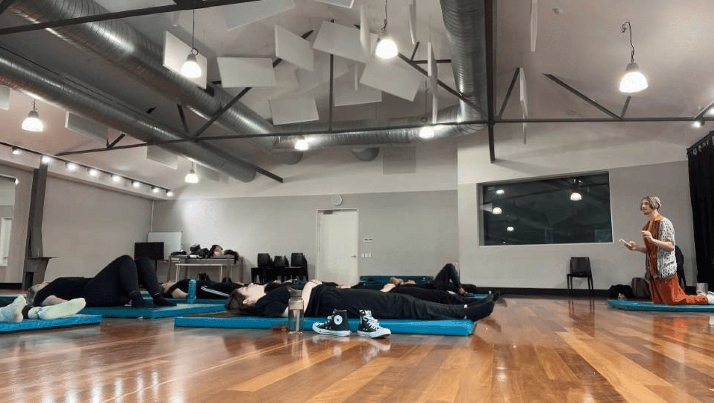a group of people in a gym room