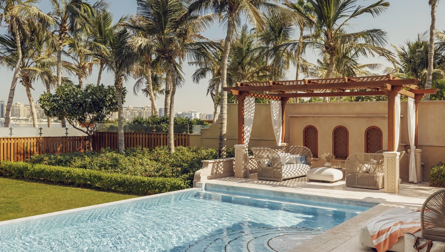 One&Only The Palm villa featuring a private pool, lush garden, and serene outdoor lounge and gazebo.