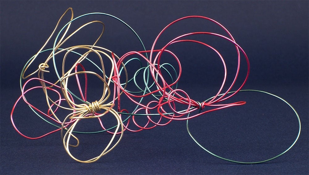 Abstract metal wire sculpture representing a motorcycle