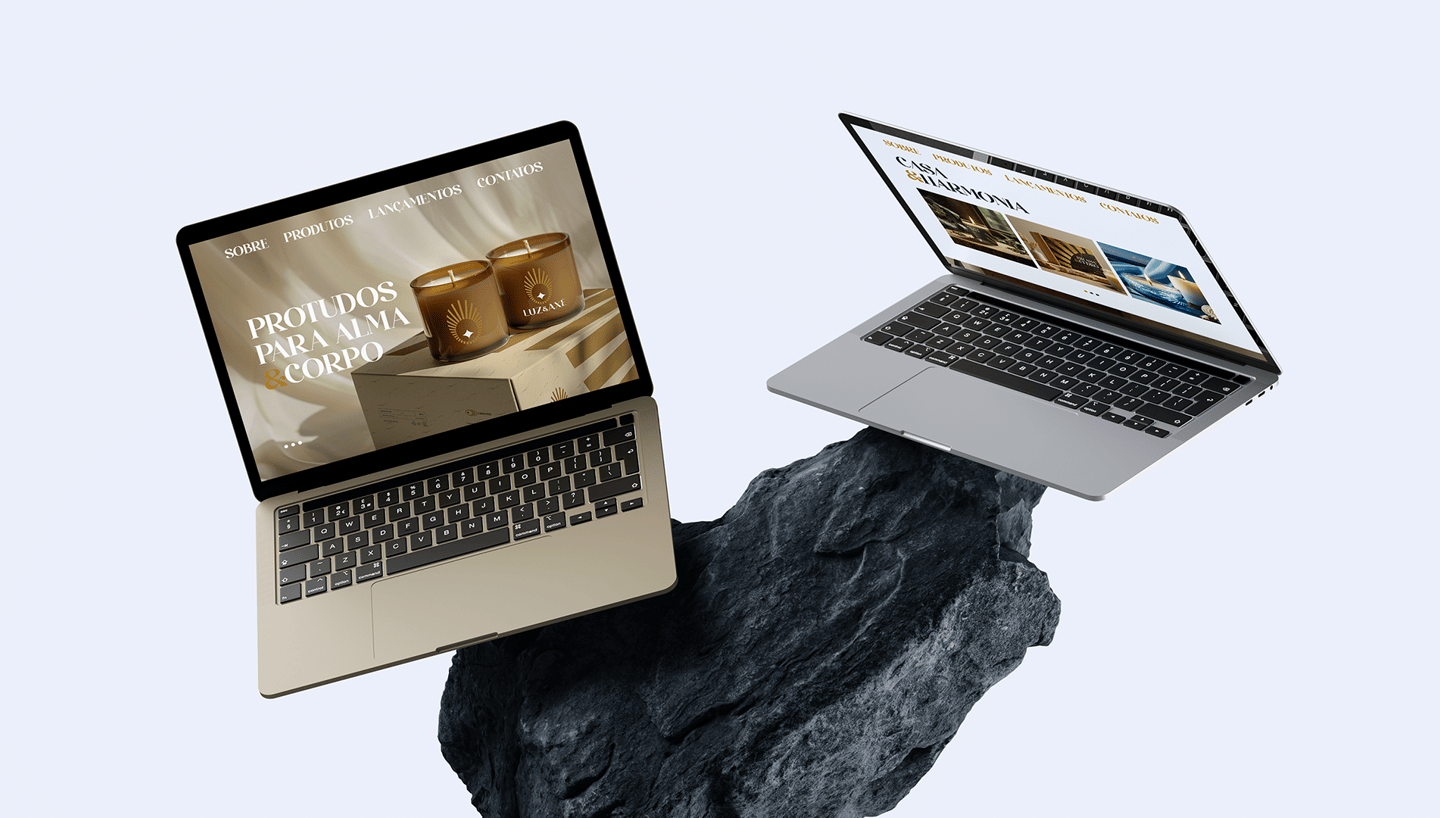 mockup of two laptops with the Luz & Axé website on top of a blue rock