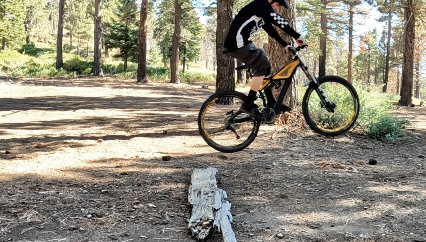 mountain biker getting air with the bump jump
