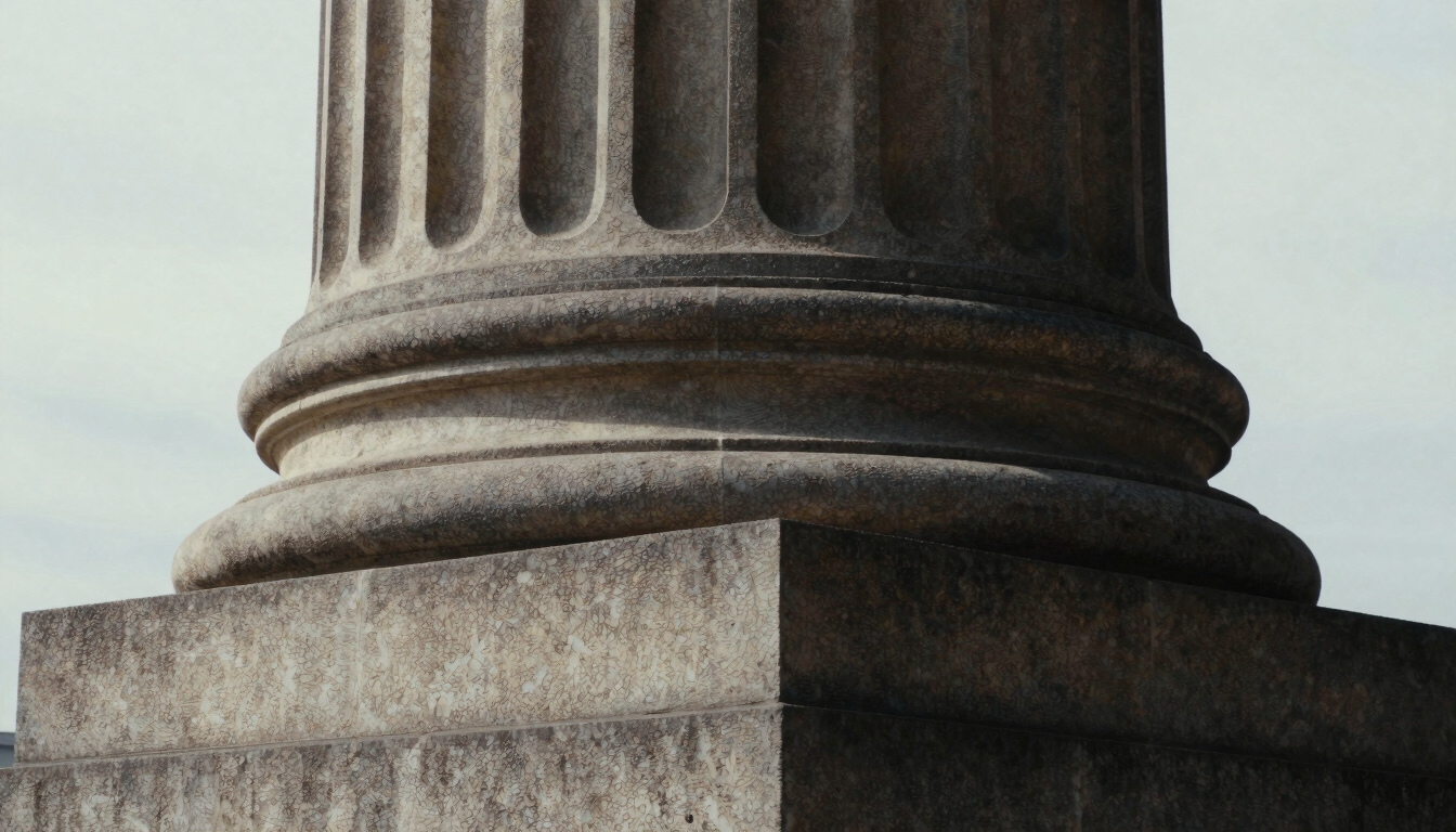 Extreme close-up of a classical stone column, deep shadows, soft overcast daylight, editorial architectural photography, 35mm film.