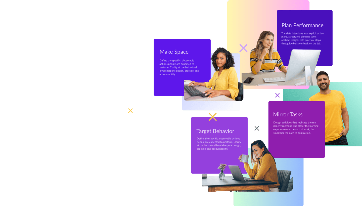 a group of people sitting at a table with laptops