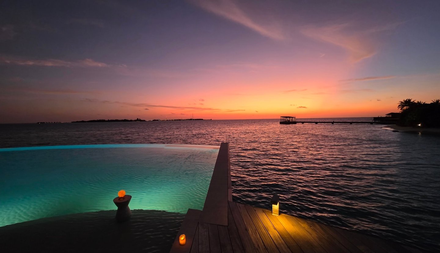 kudadoo maldives main pool sunset