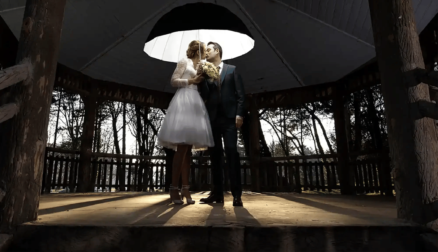 celebre weeding photographer florent lille-paris bride and groom standing under a white umbrella