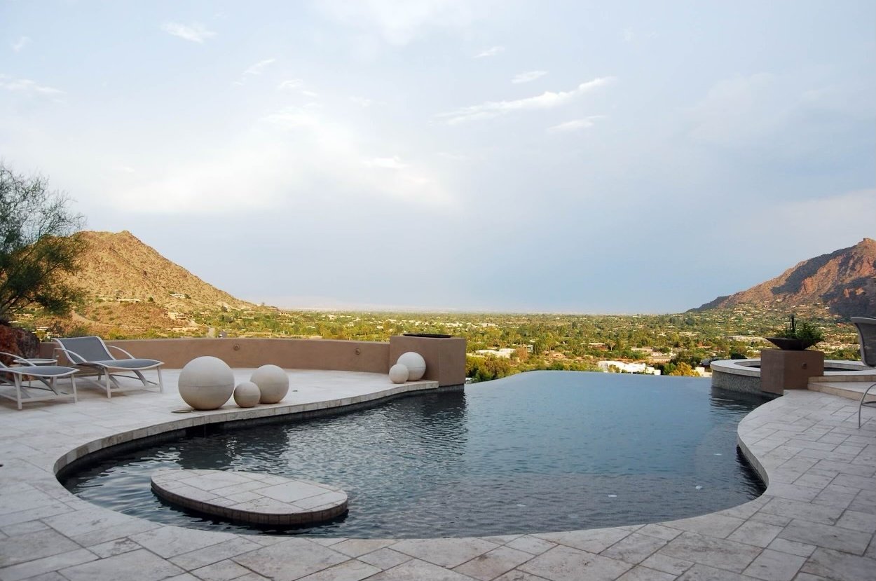a pool with a mountain view and a view of the mountains