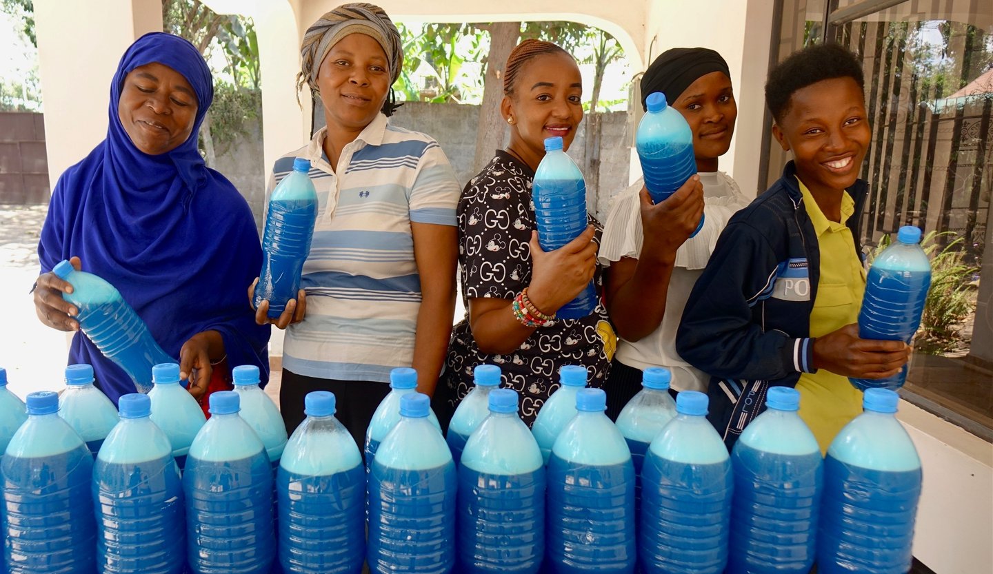 Women are happy after complete making handmade liquid soap