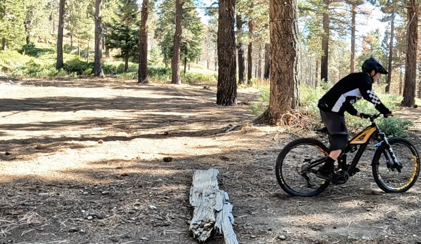 landing after a bump jump on a mountain bike