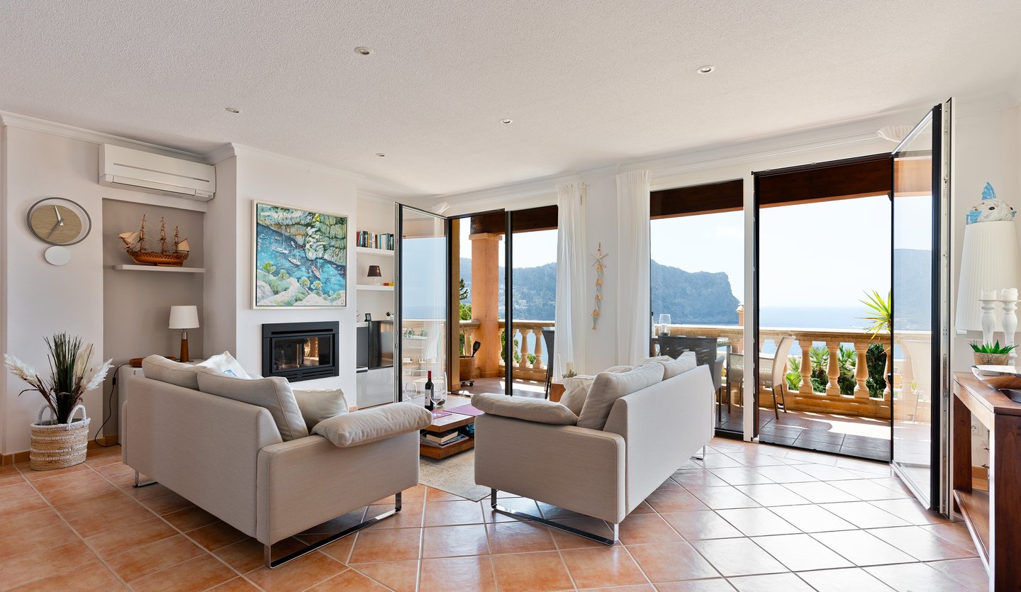 a living room with a fireplace and a fireplace