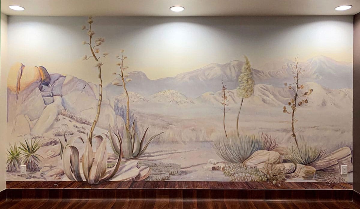 Panoramic desert mural across a private clinic waiting room wall