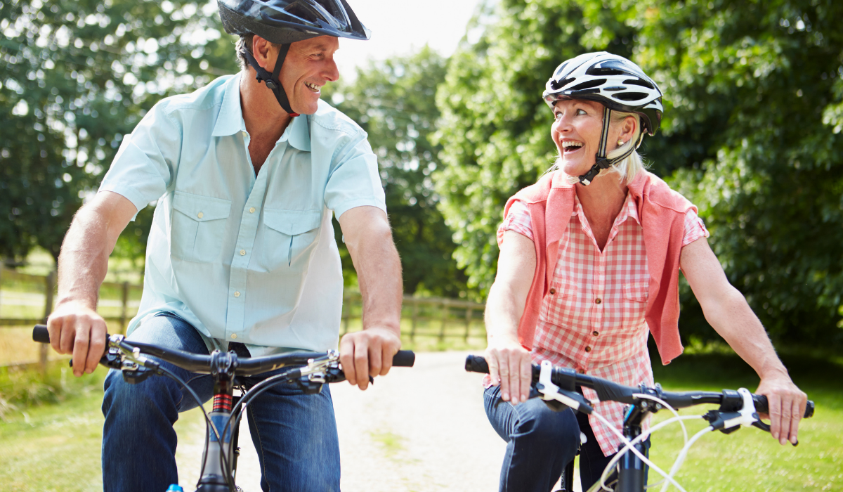 retired couple riding bikes in The Villages, FL