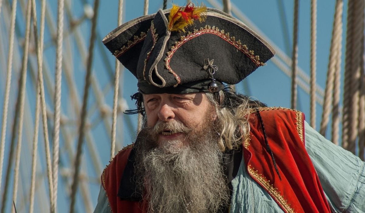 man dressed as pirate with hat and beard