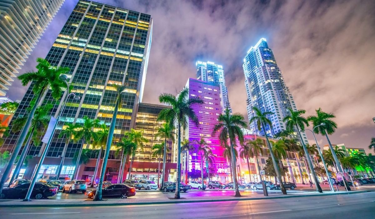 city of miami at night with colored lights