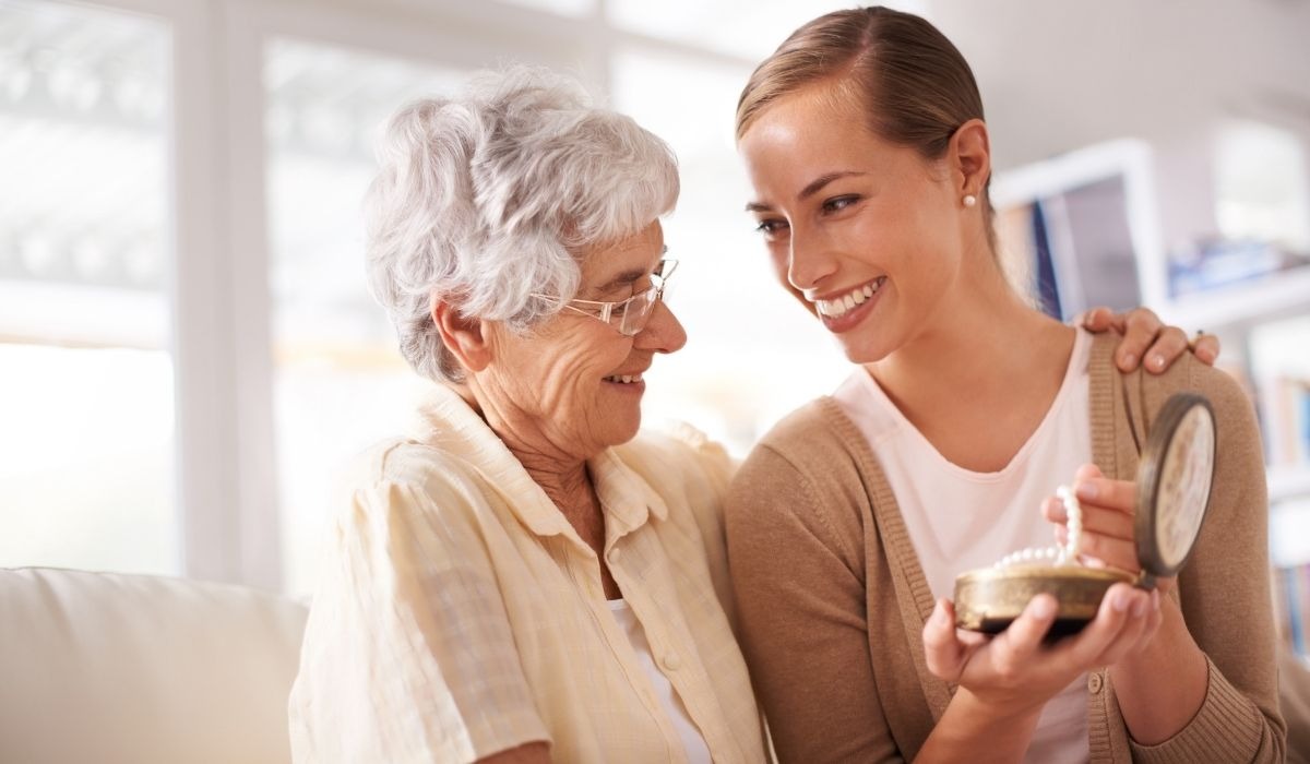 senior woman laughing with daughter