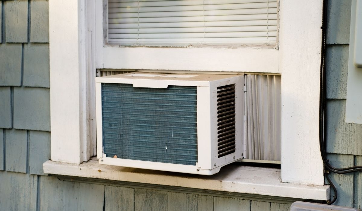 window unit air conditioner in old house window