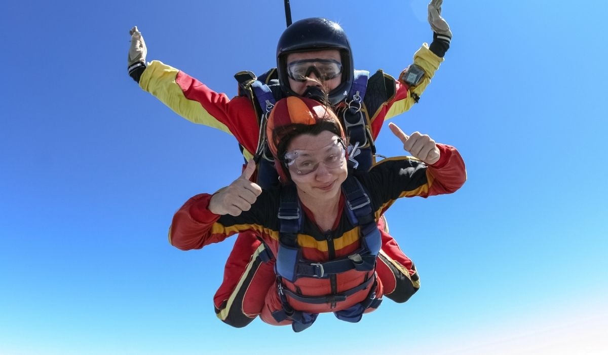 woman parachuting with instructor