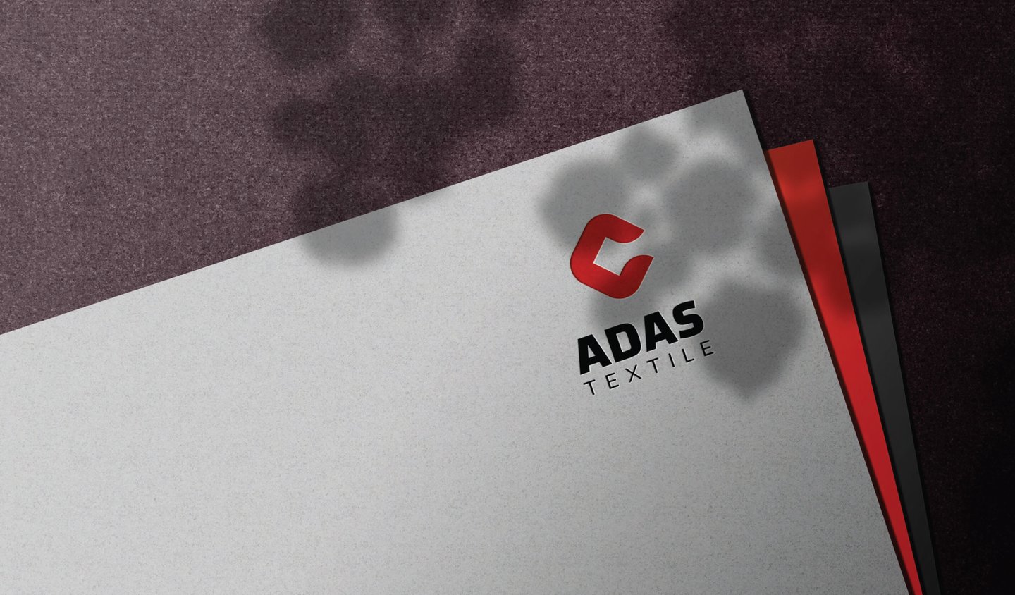 a close up of a business card with a red and white background