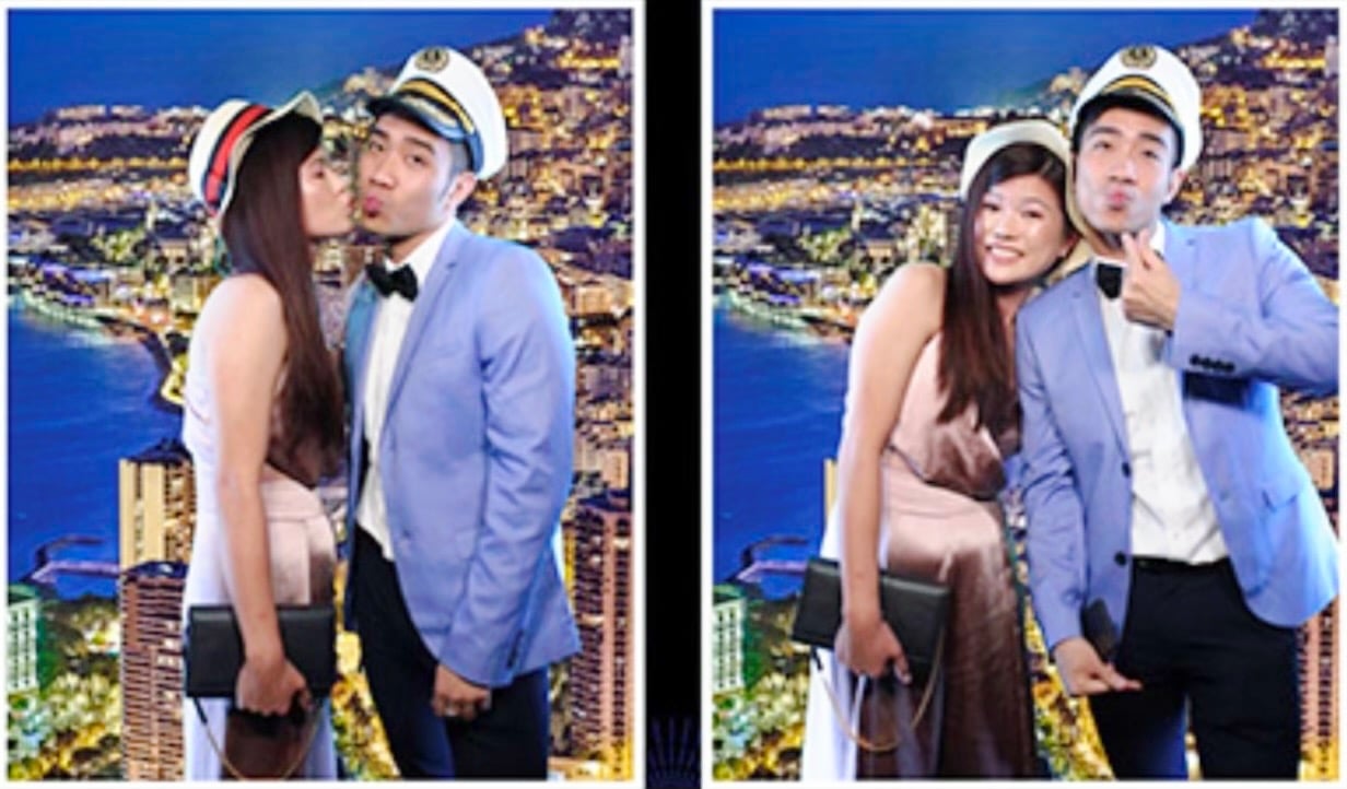 Couple posing with a Green Screen taken at a celebration Mirror Photo Booth.